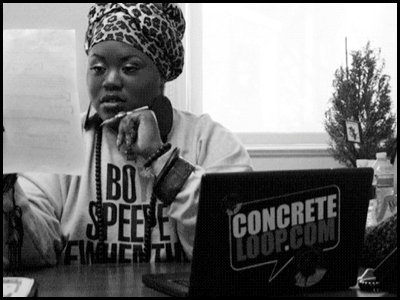 Angel Laws Founder of Concrete Loop working in her office | Shetalksbiz.com